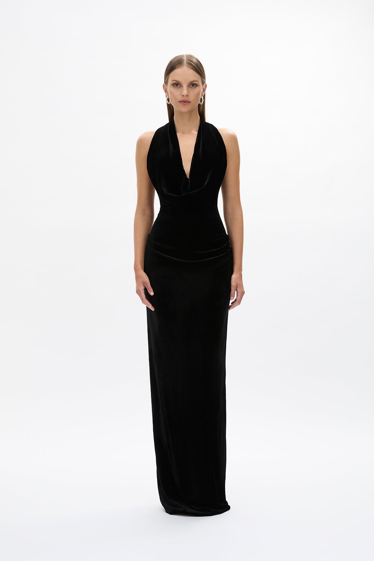 Second front image of model wearing Rachel Gilbert Martin Plunge Gown, black velvet halter gown with deep plunge neckline and internal corset.