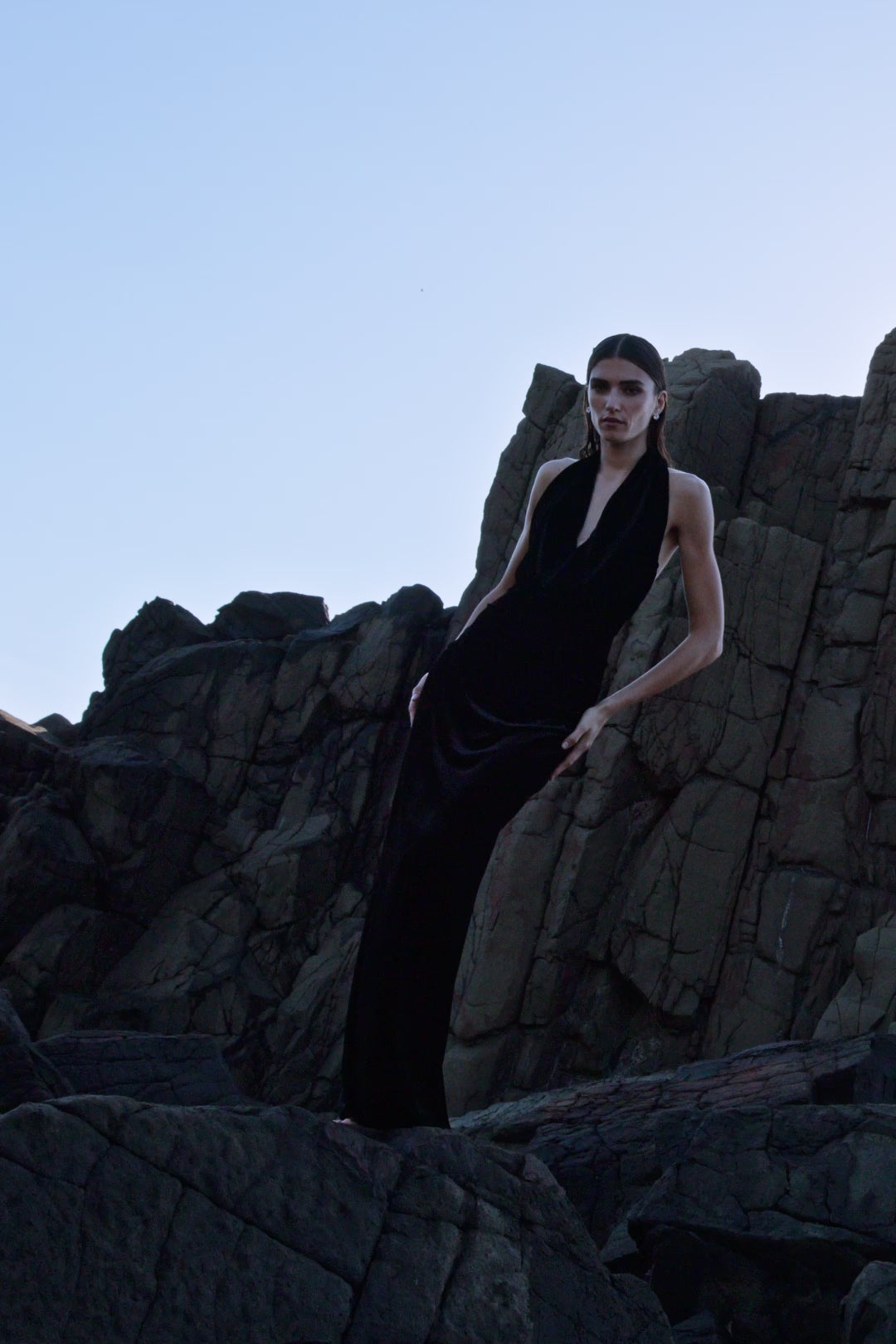 Video of model wearing Rachel Gilbert Martin Plunge Gown, black velvet halter gown with deep plunge neckline and internal corset.